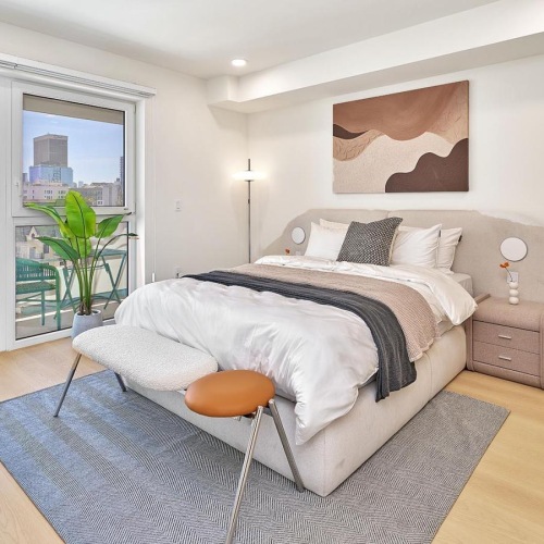 a bedroom with a bed and a table