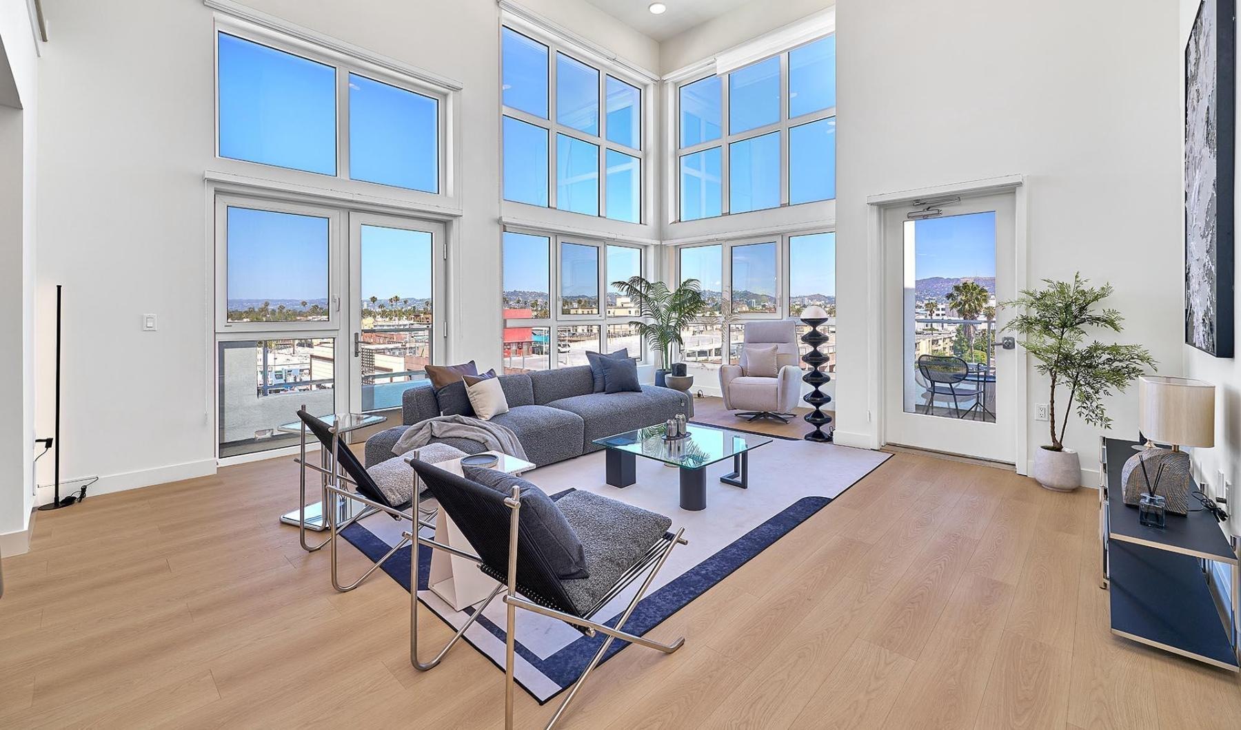 a living room with a couch and chairs