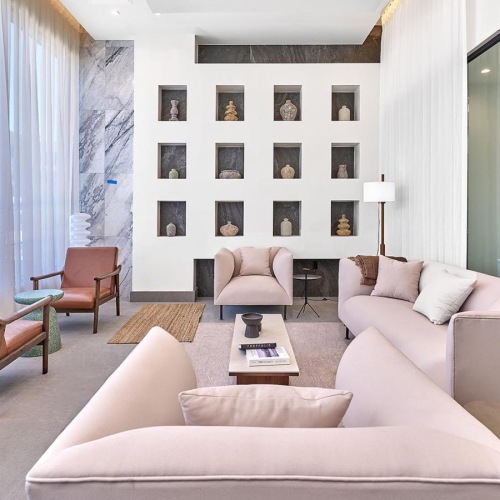 a clubroom with couches and chairs
