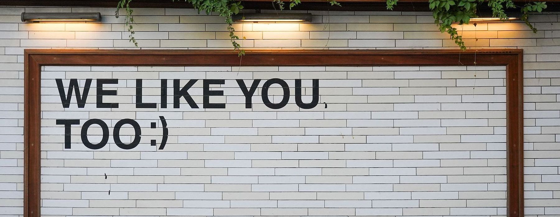 a sign on a tile wall